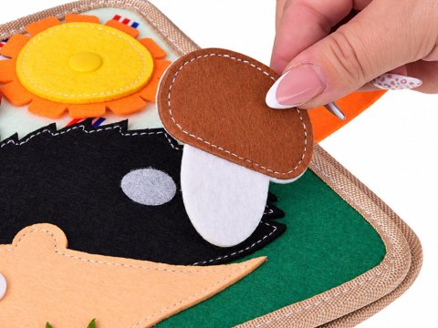 Książeczka sensoryczna manipulacyjna z rzepami i ruchomymi ele. ZA6600